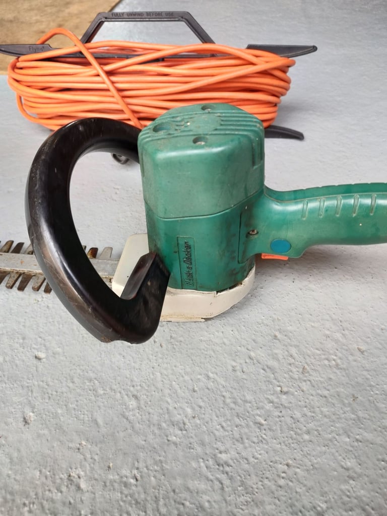 Black & Decker electric hedge trimmer & cable.