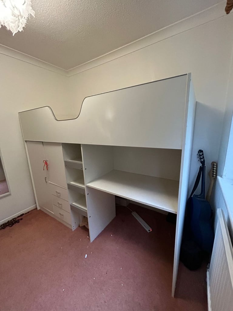 Cabin bed with built-in wardrobe and workstation. 
