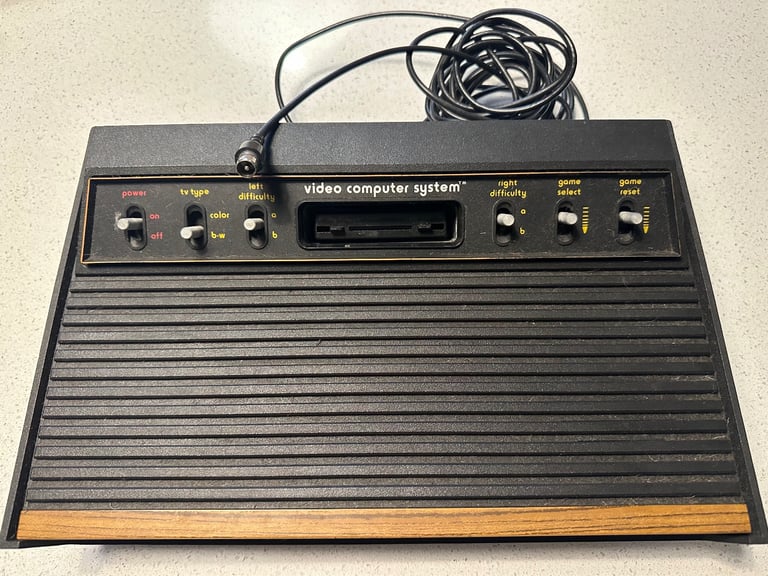 image for Atari 2600 Woody Game Console With 4 Controllers and multiple games - Untested