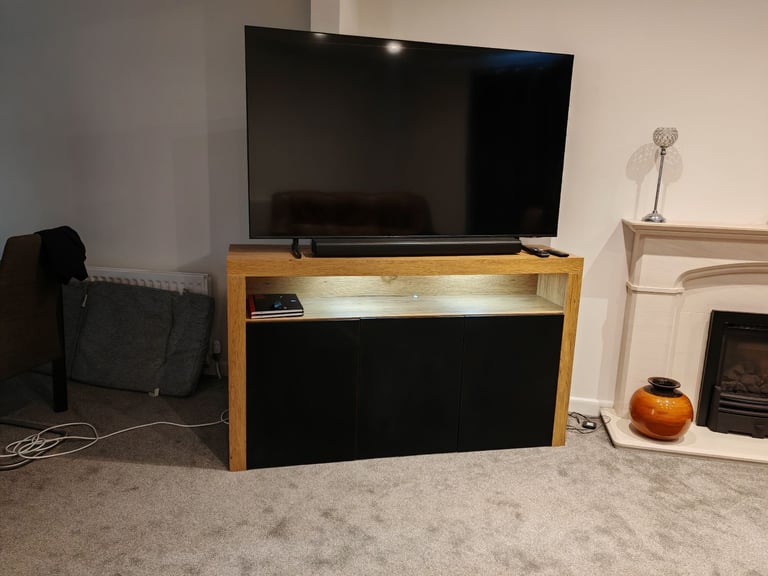 image for Solid Wood TV Stand - As New Condition - Brown veneer with black doors and shelf lighting