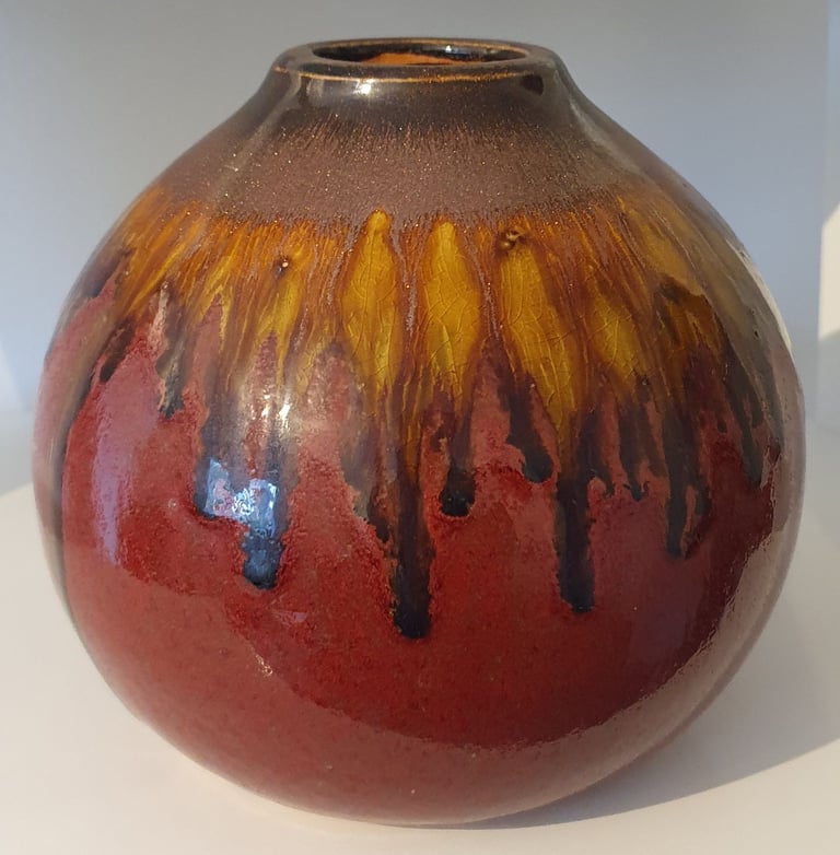 image for Pair of glazed ceramic red vases.