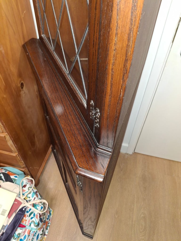 The Jaycee Vintage Oak Corner Display Cabinet is used but in very good condition.