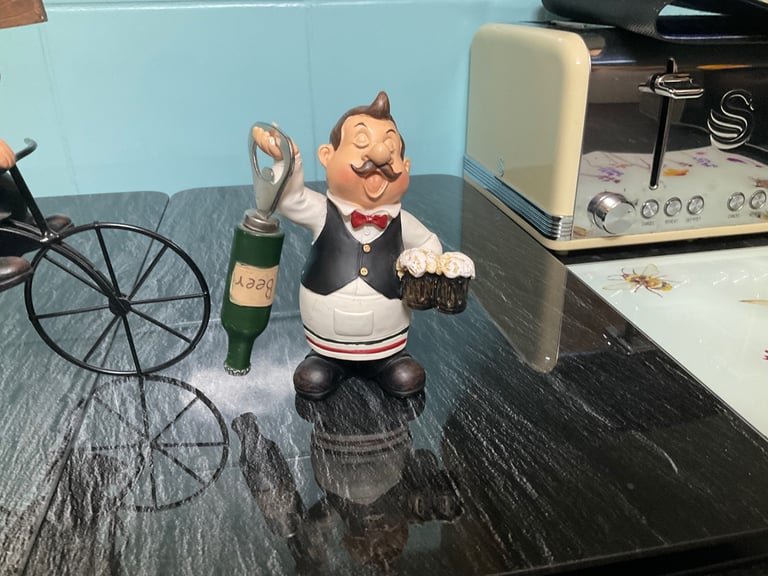 Bottle holder and opener.