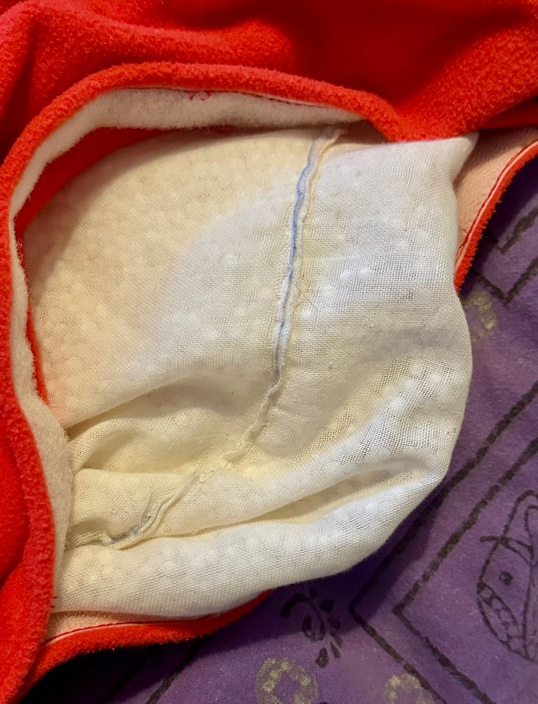 Pet beanbag in orange fleece. 