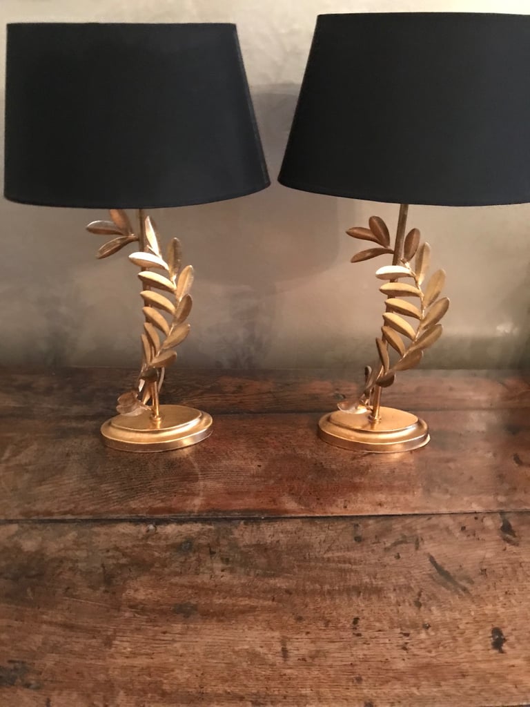 Pair of Laura Ashley side lamps gold with black shades. 