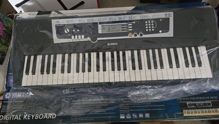 Yamaha YPT-210 Electric Keyboard with Stand and Manual