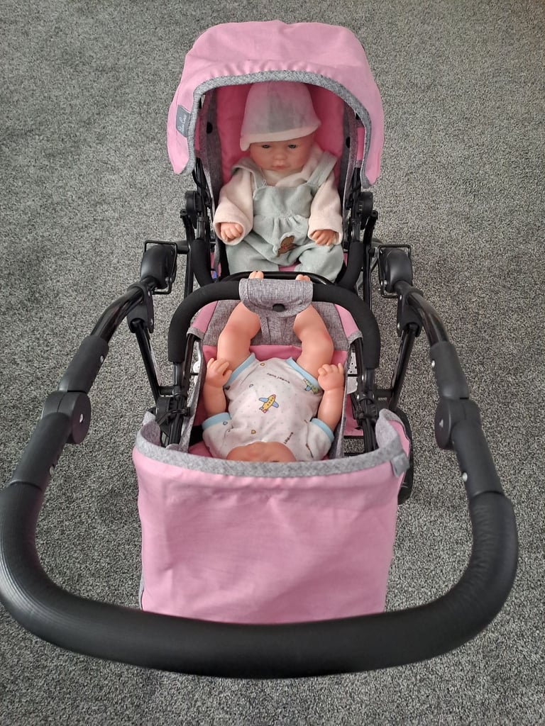 Childrens twin buggies with twin dolls 