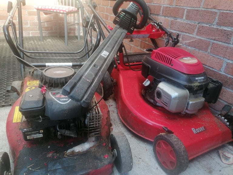 Two petrol lawn mowers, electric hedge trimmer