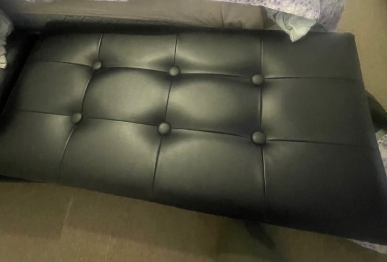 Black faux leather storage bench