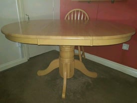 image for HEAVY ROUND EXTENDING DINNING TABLE