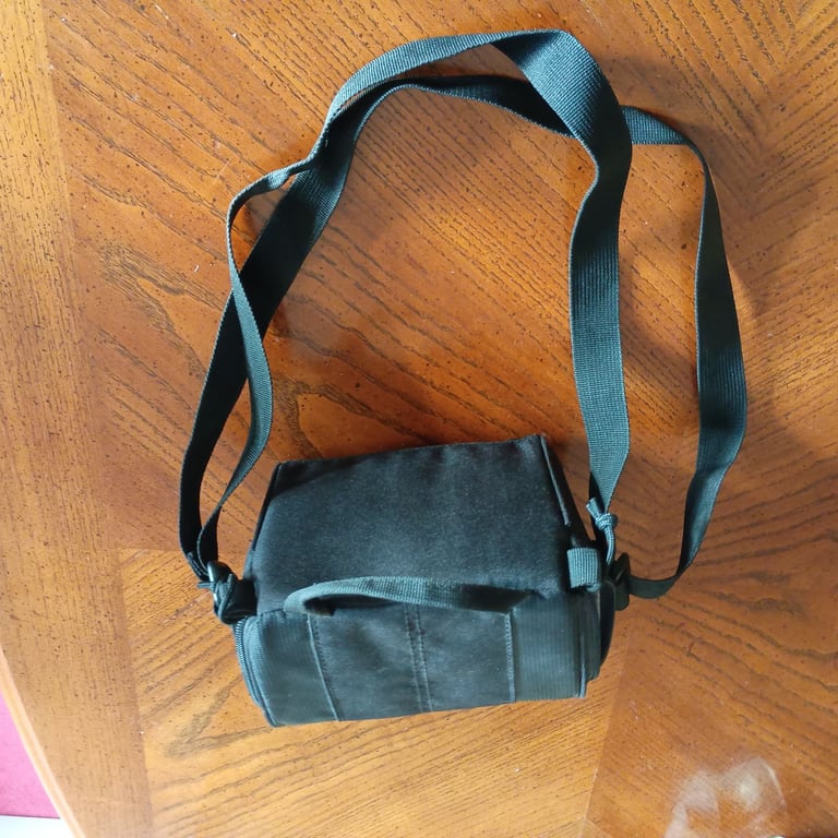 Small Lowepro camera bag with shoulder or waist strap. Waterproof .Black. Ideal for trekking. As new