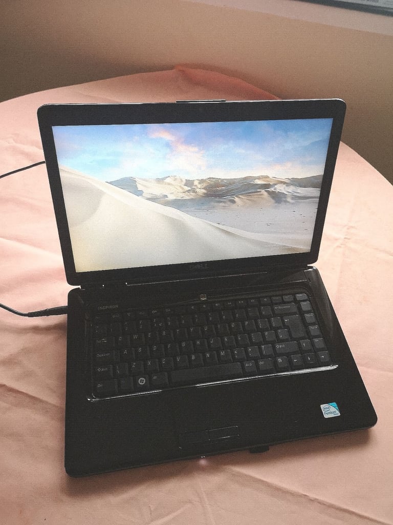 Dell Inspiron Laptop on Windows 10 with pink colour lid. . Pink colour. 
