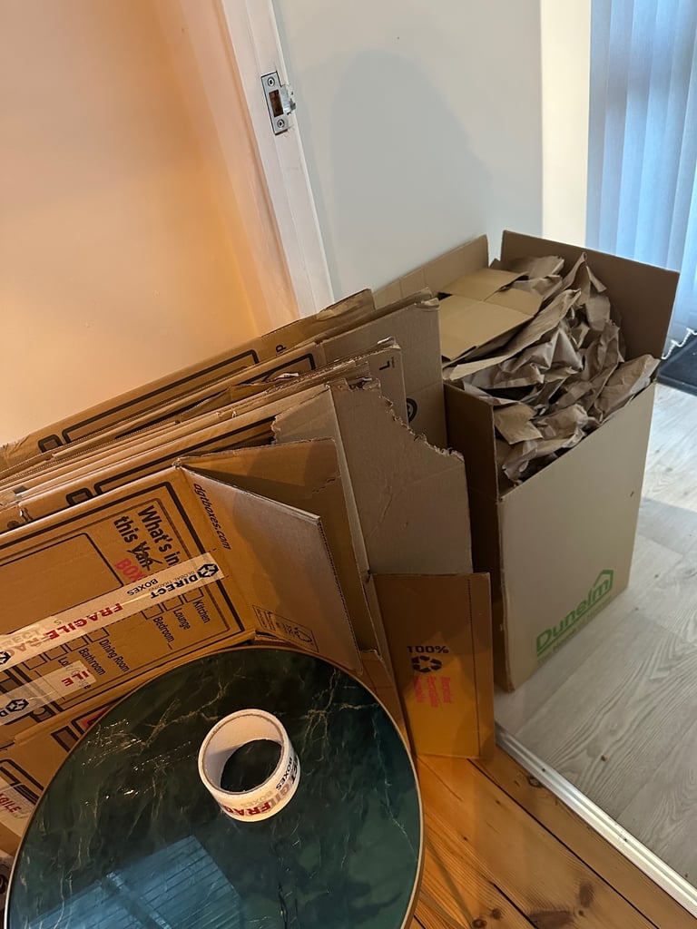 image for Cardboard boxes, bubble wrap, paper and tape for packing 