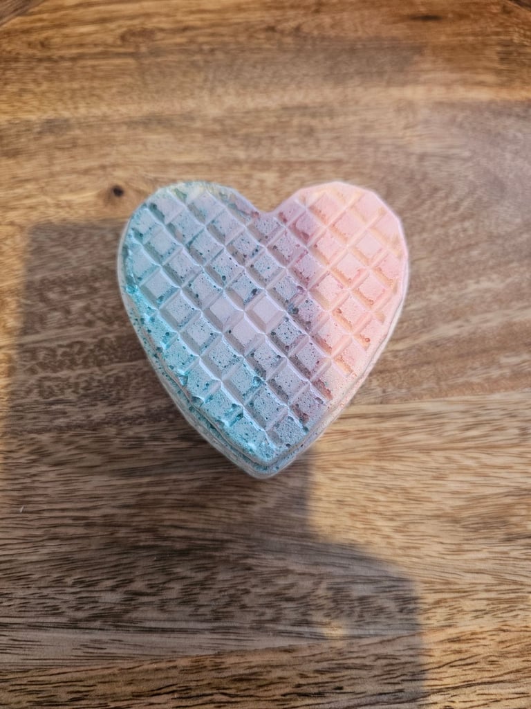 Handmade candle in a heart ceramic holder