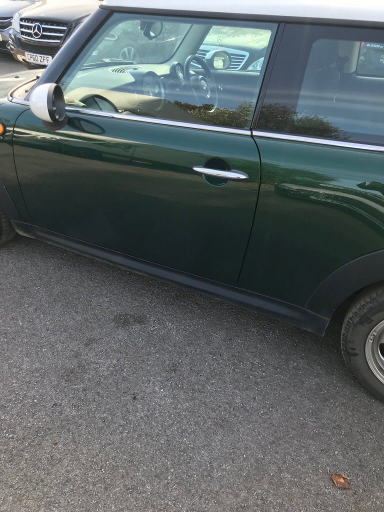 Mini Cooper in racing green breaking 2012