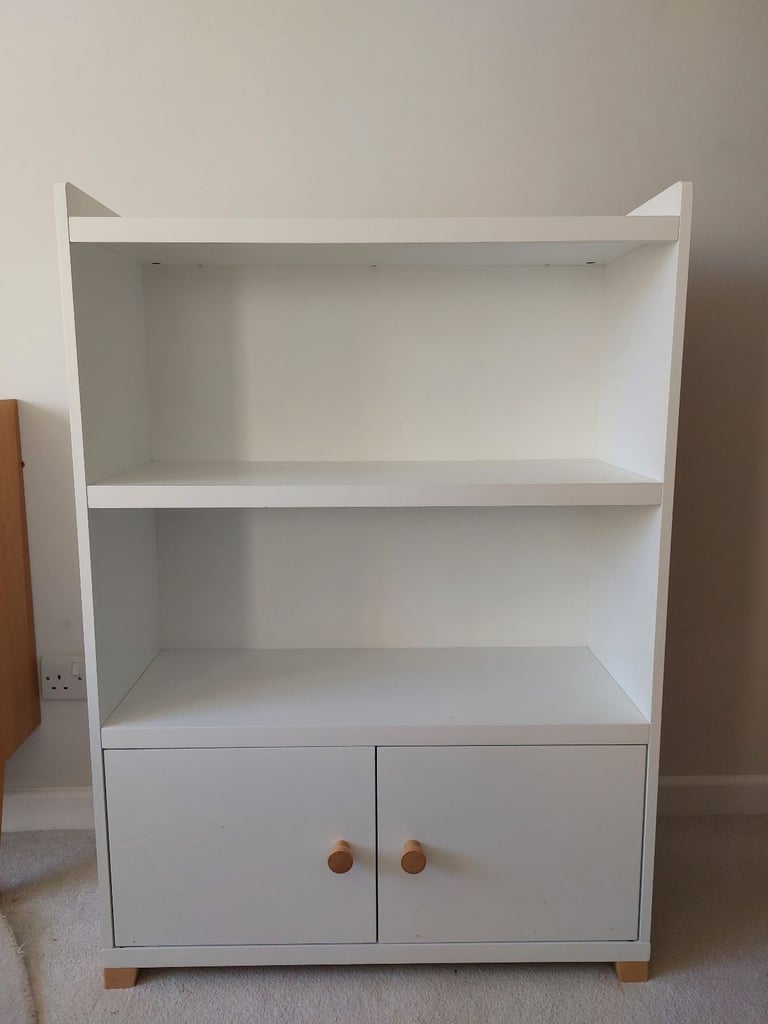 Child's room white bookcase with cupboard