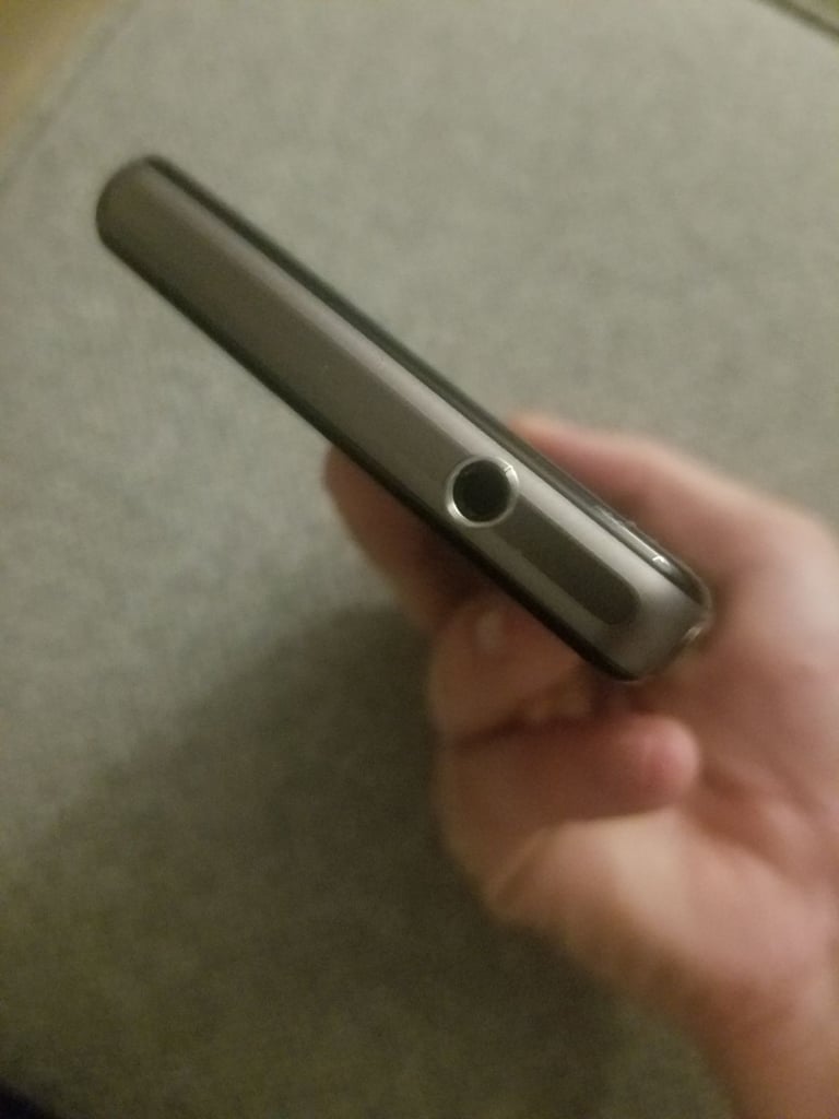 Black sony mobile with charger