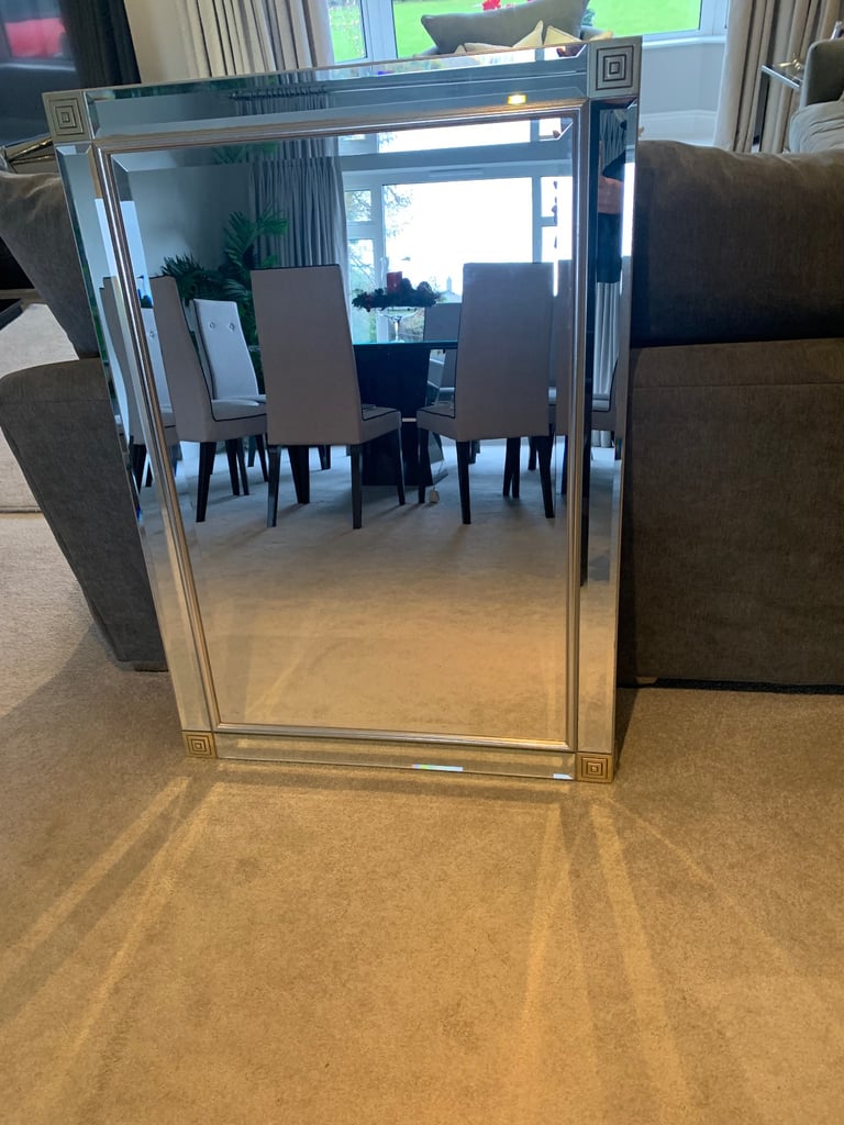 Large frameless mirror with corner detailing