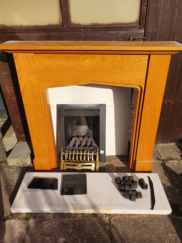 Wooden fire surround with backplate, hearth, coals and metal grate.joblot ***no gas fire**