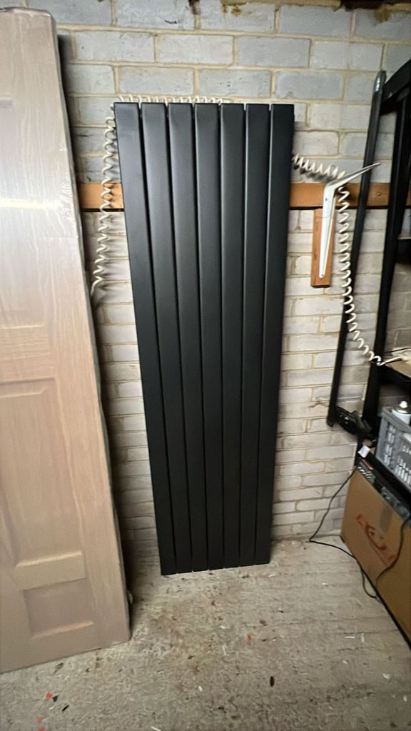 Unused tall charcoal grey radiator
