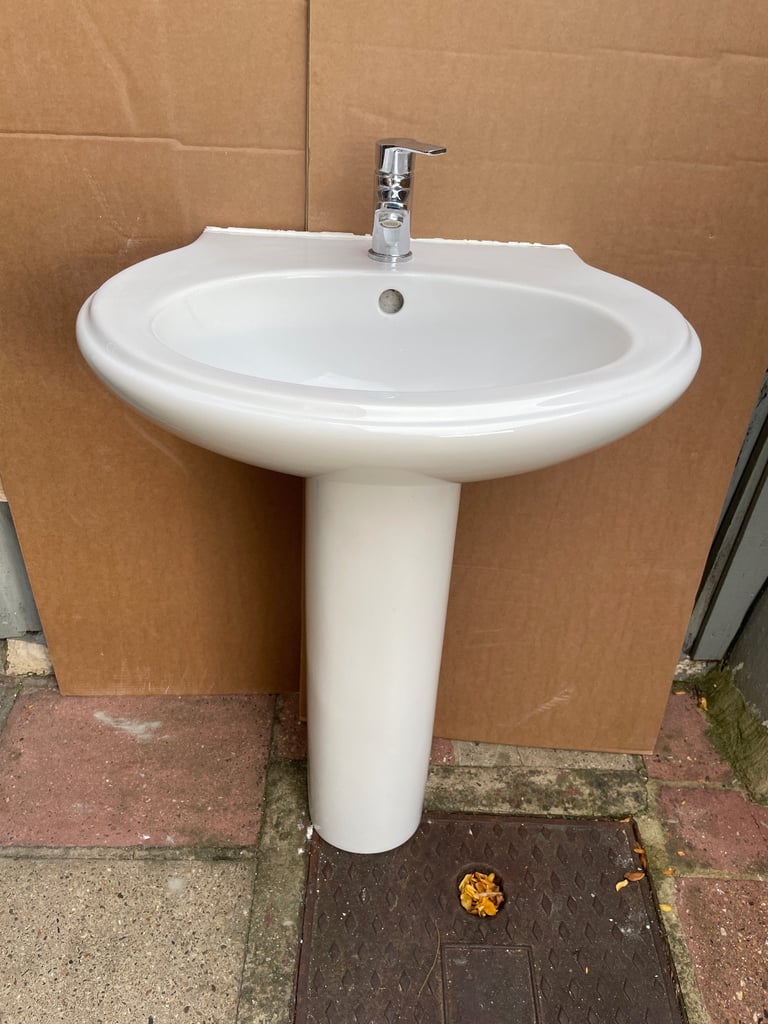 Basin with pedestal and tap