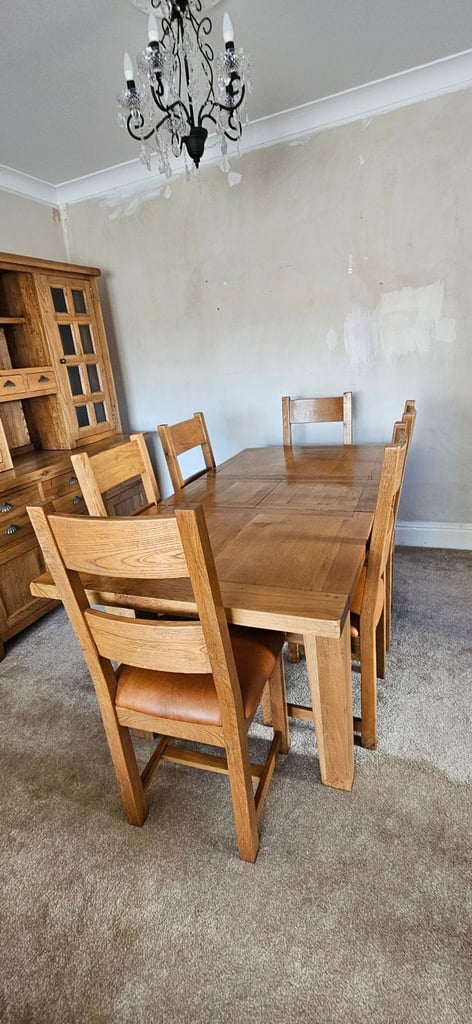 Oak dining table with six chairs and oak dresser