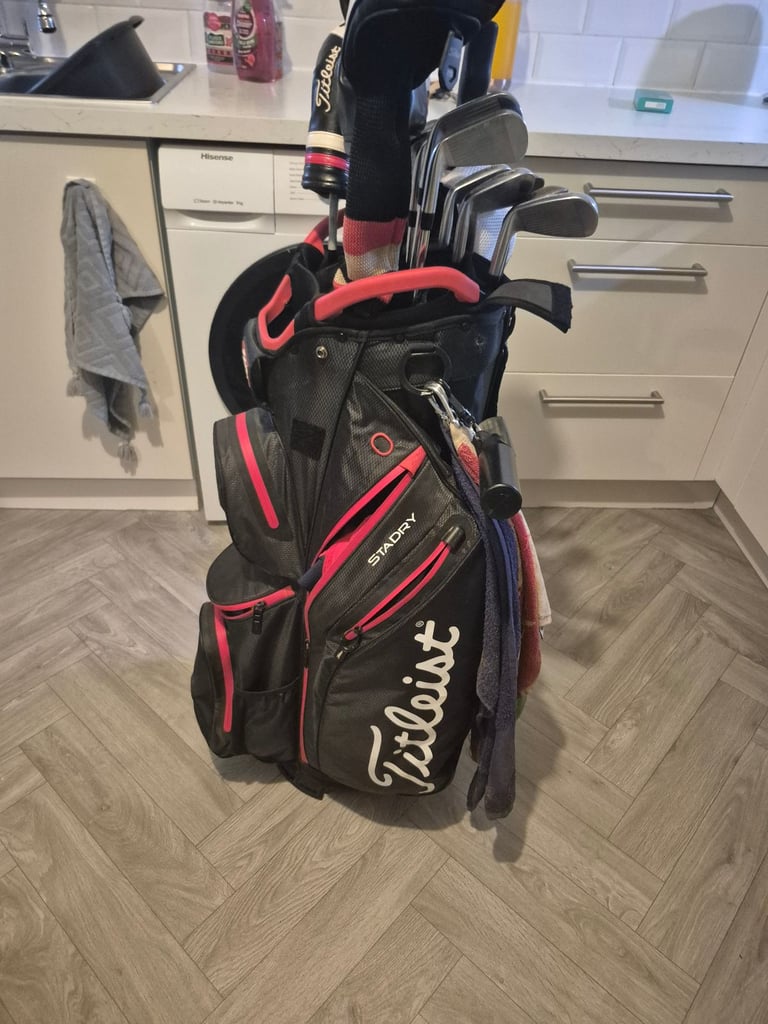 Full set titleist irons,driver, 3 wood, hybrid, mizuno rusty wedges and titleist bag 