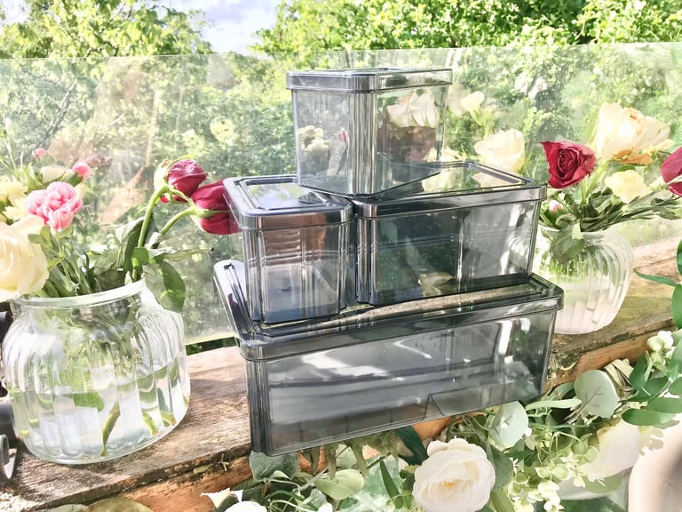 Good quality. Set of 4 Black tint plastic storage boxes Only used a few times