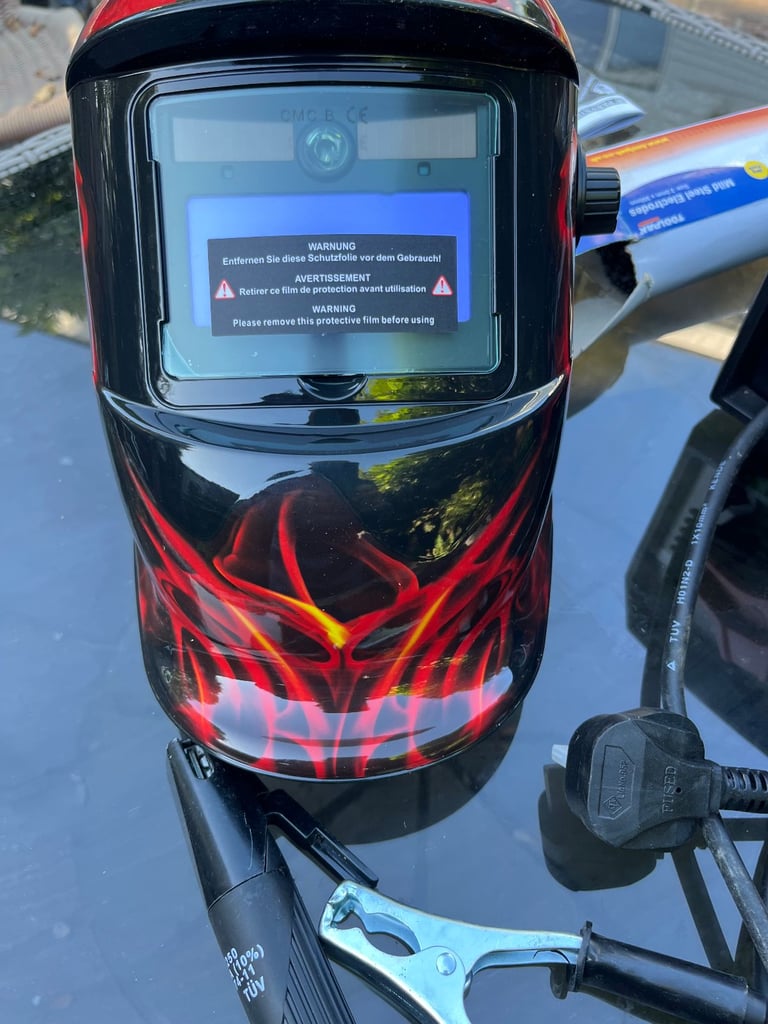 ARC WELDER + AUTO WELDING HELMET + BOX OF RODS