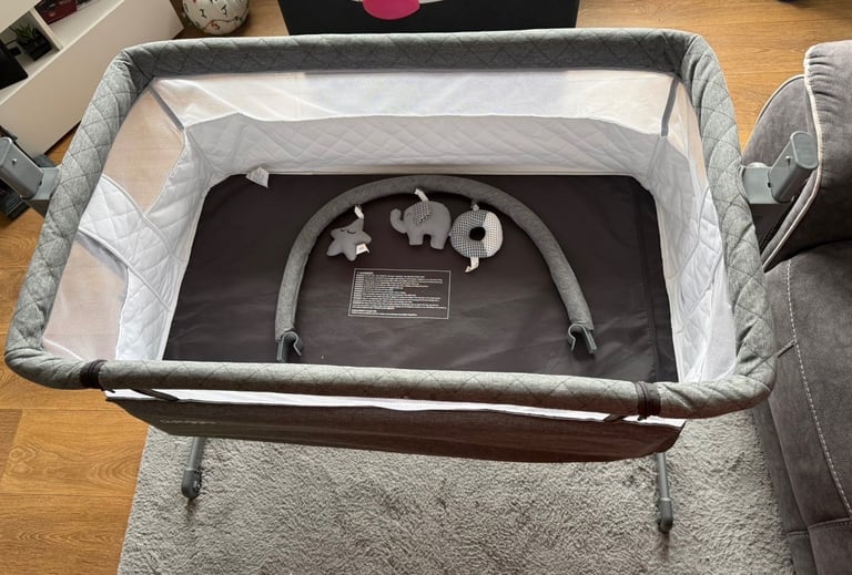 image for Puggle Sleepy Rocking Bedside Crib With Toy Bar & Fitted Sheet with mattess Graphite Grey