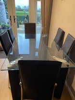 Glass top 2 tier dining table with chrome legs (NO CHAIRS).