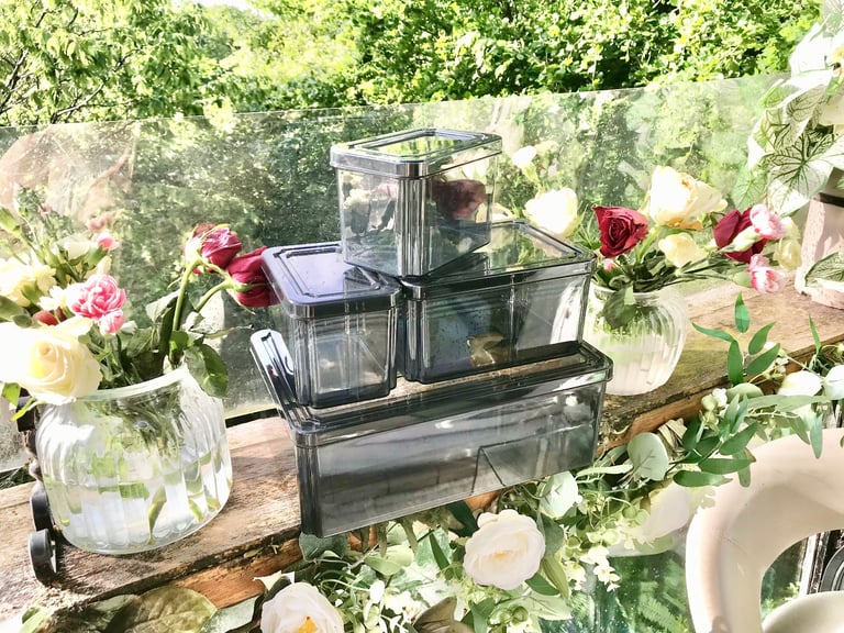 Good quality. Set of 4 Black tint plastic storage boxes Only used a few times