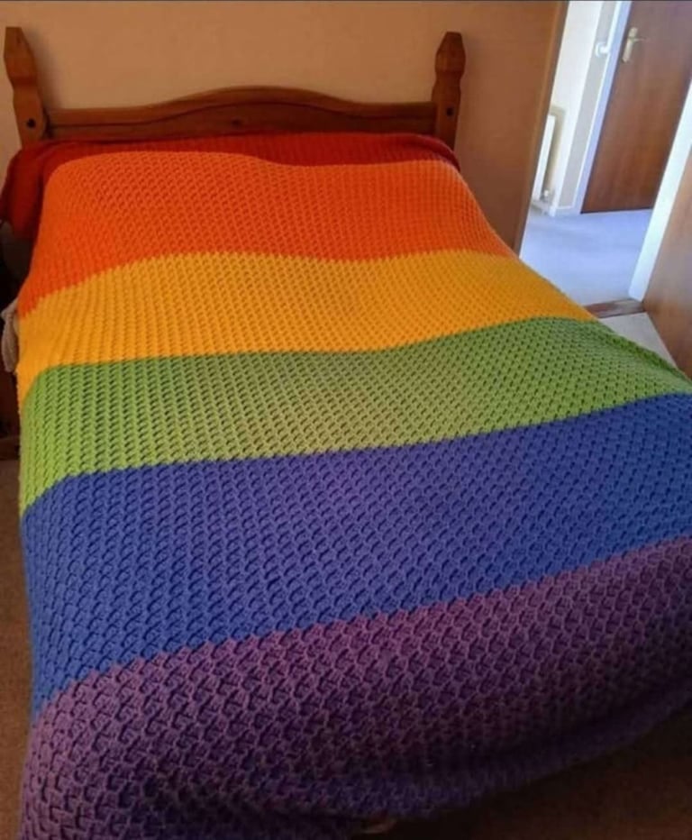 Crocheted king-size.  Rainbow colours Striped blanket