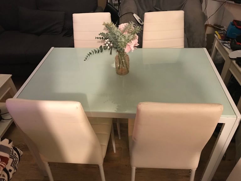 image for White metal glassed top with four dining chairs