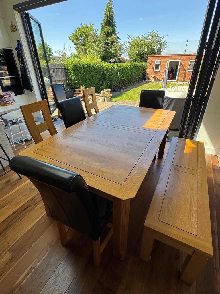 image for Oak Furnitureland solid oak extendable dining table, bench and 6 chairs