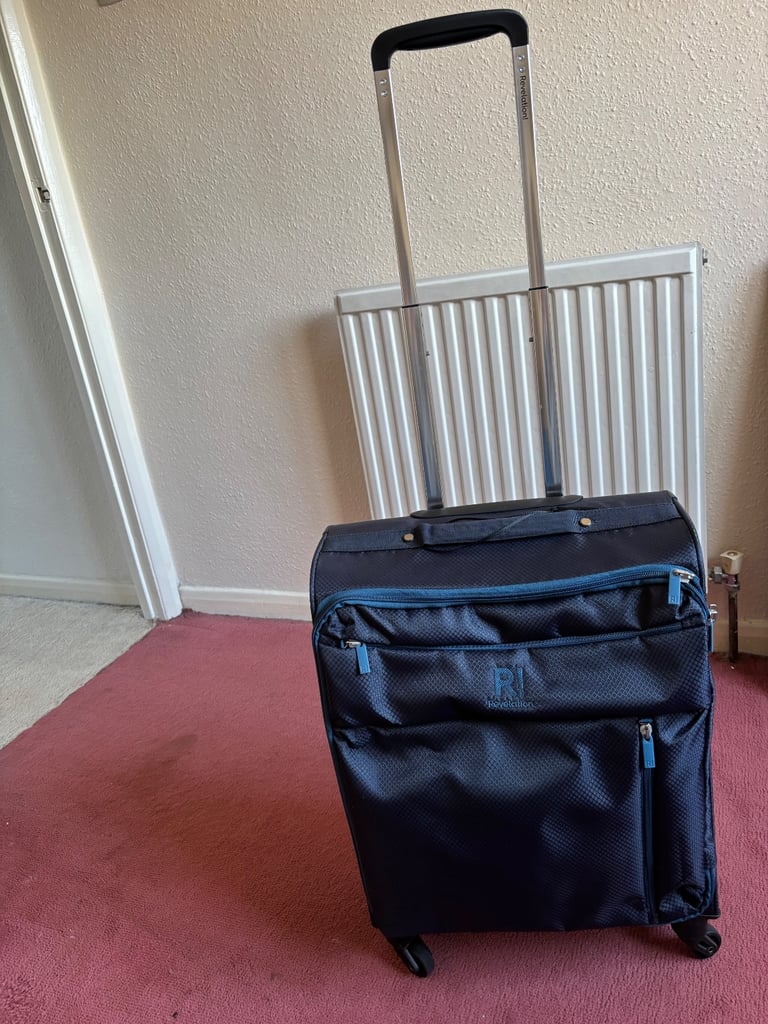 Small suitcase with wheels and extending handle