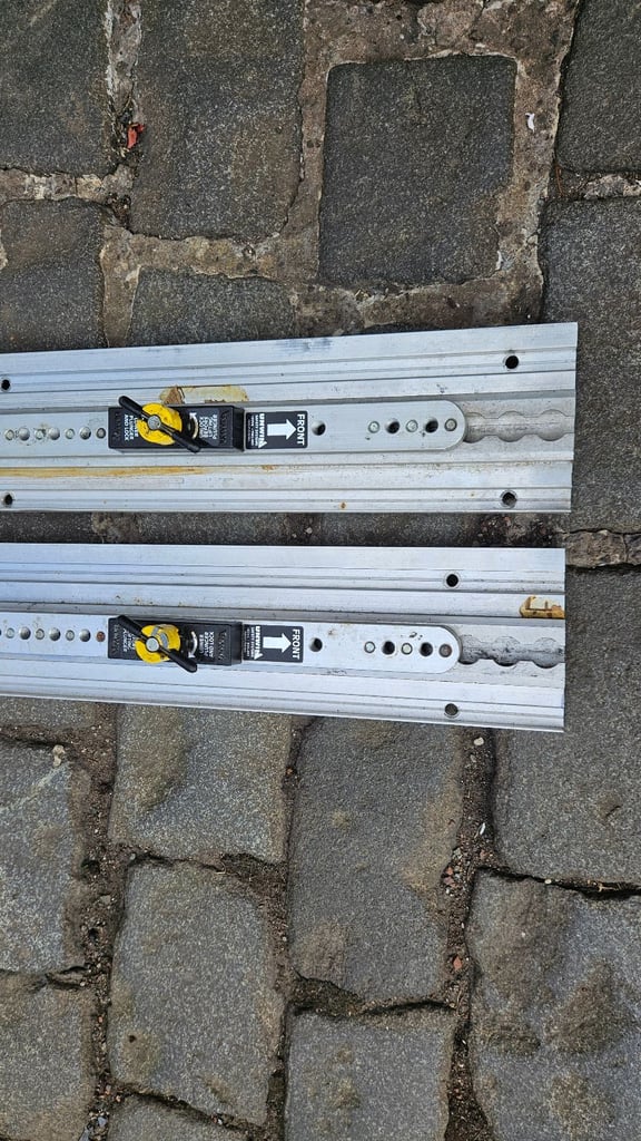 2 Unwin heavy duty floor rail tracks with clamps and end pieces.