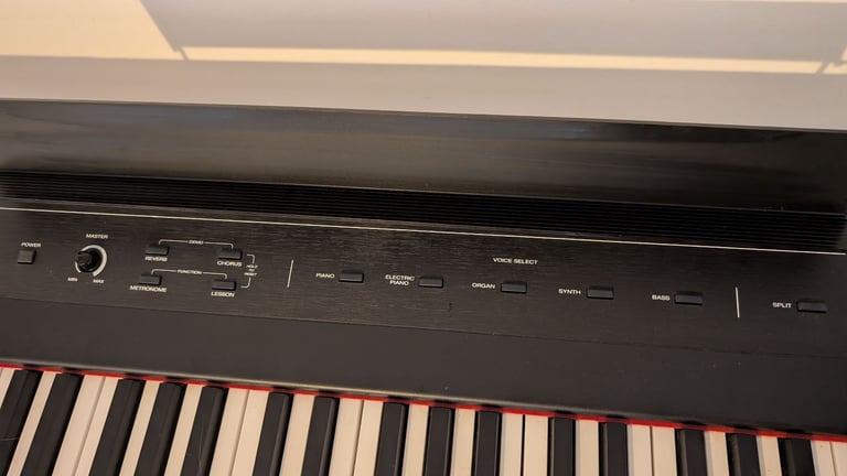 Alesis 88 key semi-weighted keyboard with stand and sustain pedal included