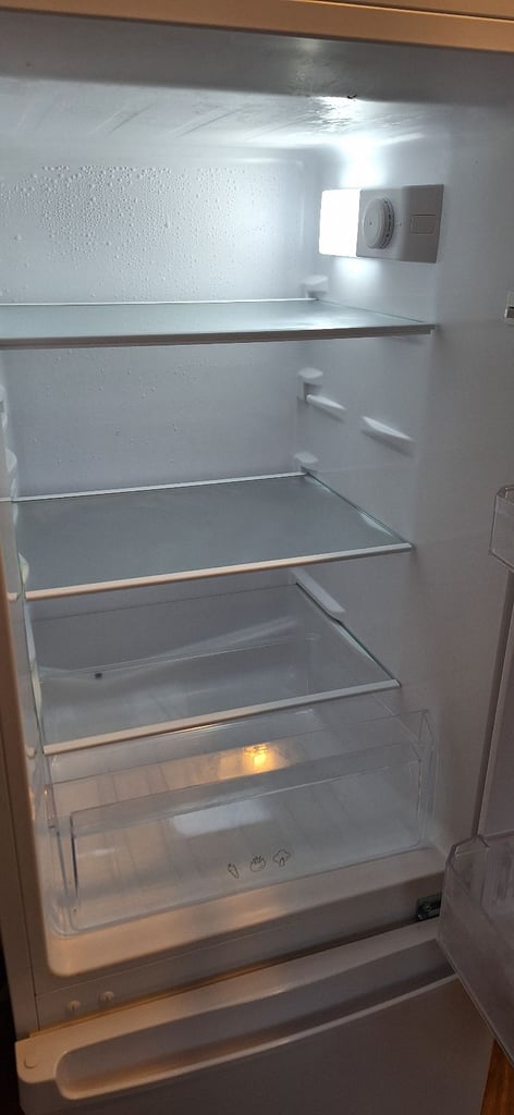 LOGIK fridge freezer size  H 142cm like new one year old 