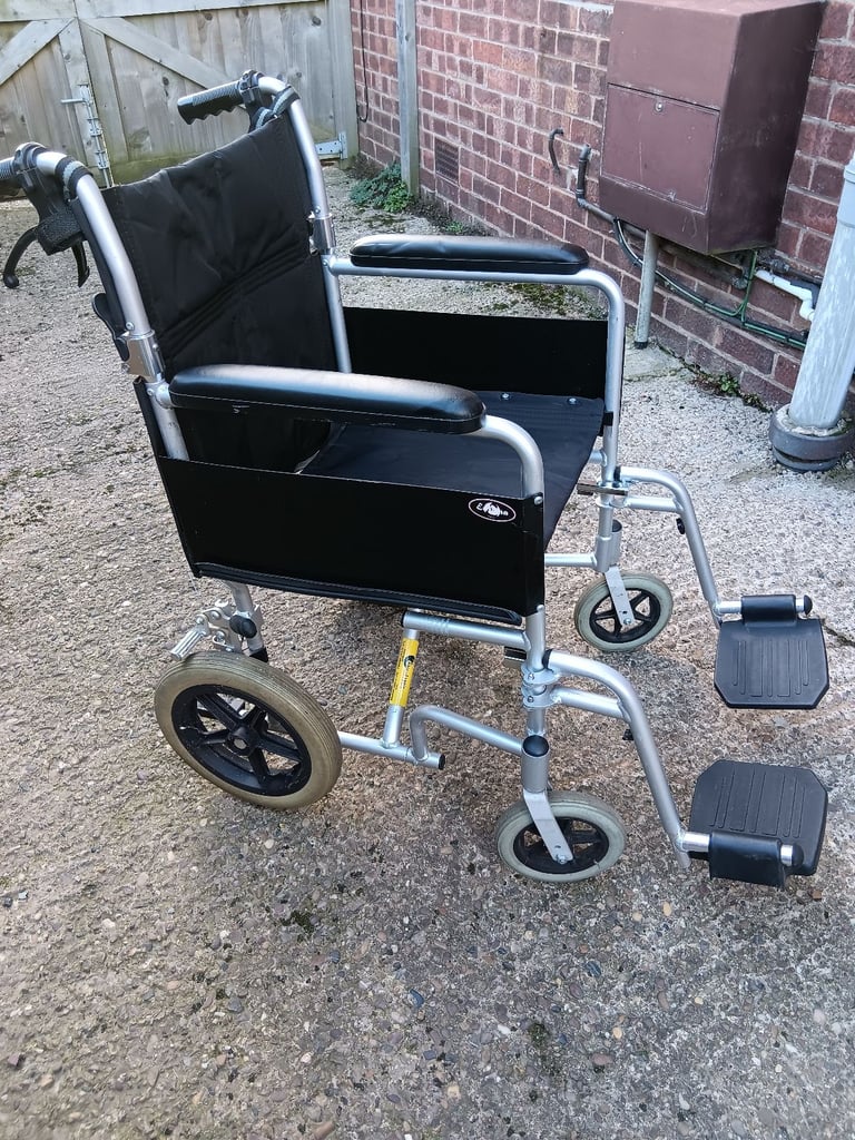 image for Enigma Lightweight Foldable Wheelchair with Wheelchair Rucksack and Rain Poncho