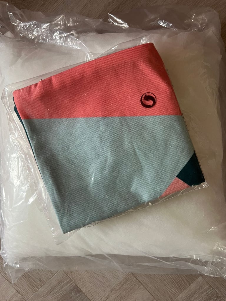 Brand new blue/green and pink/coral square cushion. 