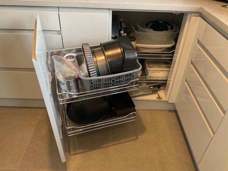 Brand new .Magic corner pull out basket system for Left Hand opening on corner unit.