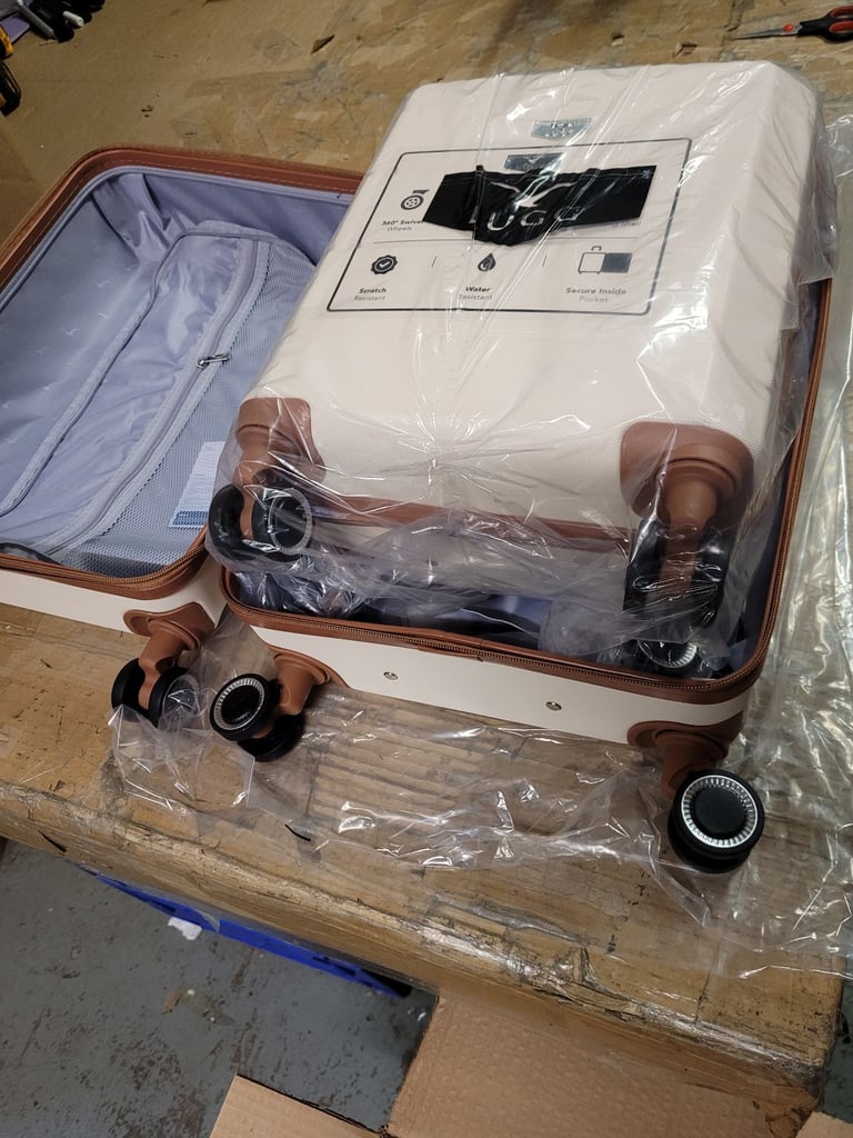 A new still packed cream x brown 2 pcs hard shell suitcase set it is 