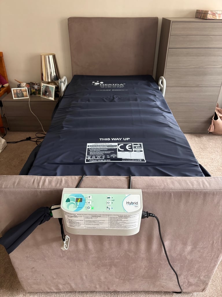 Theramatic variable height and profiling bed