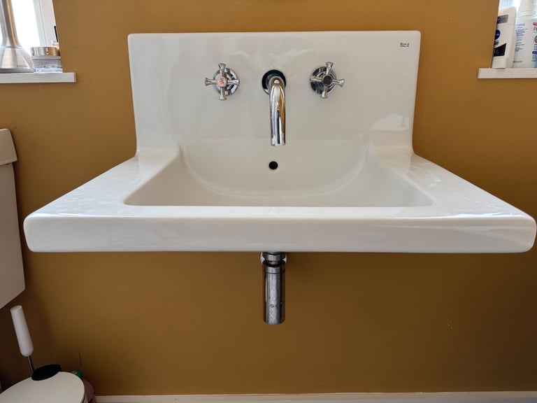 Roca wall mounted sink with back splash
