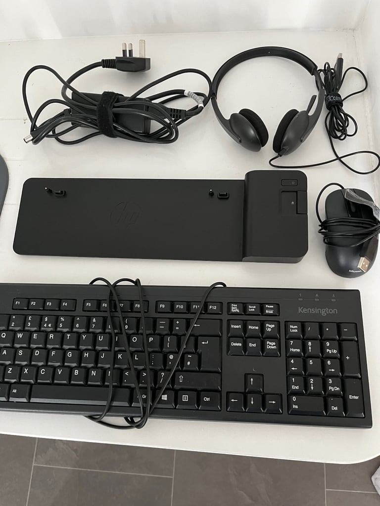 HP ultra slim laptop docking station, mouse, keyboard, cables and headphones