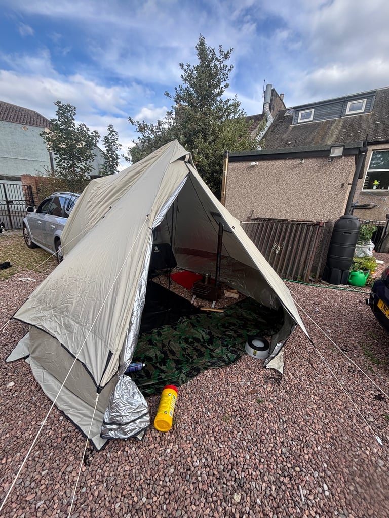 Car bell tent with log burner 