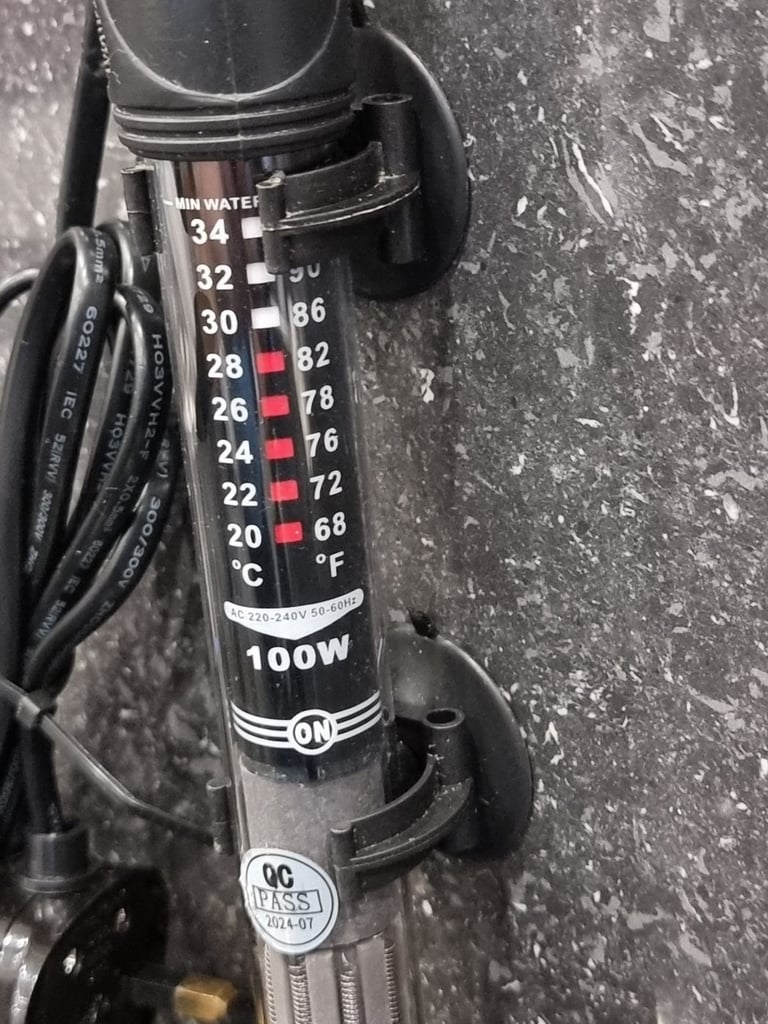 Fluval U4 underwater filter, thermometer and faux stone decoration