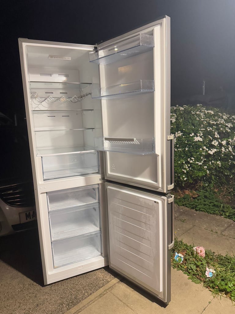 Tall fridge freezer for £150(we can deliver)