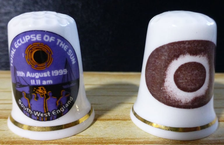 image for Two thimbles commemorating the solar eclipse in 1999
